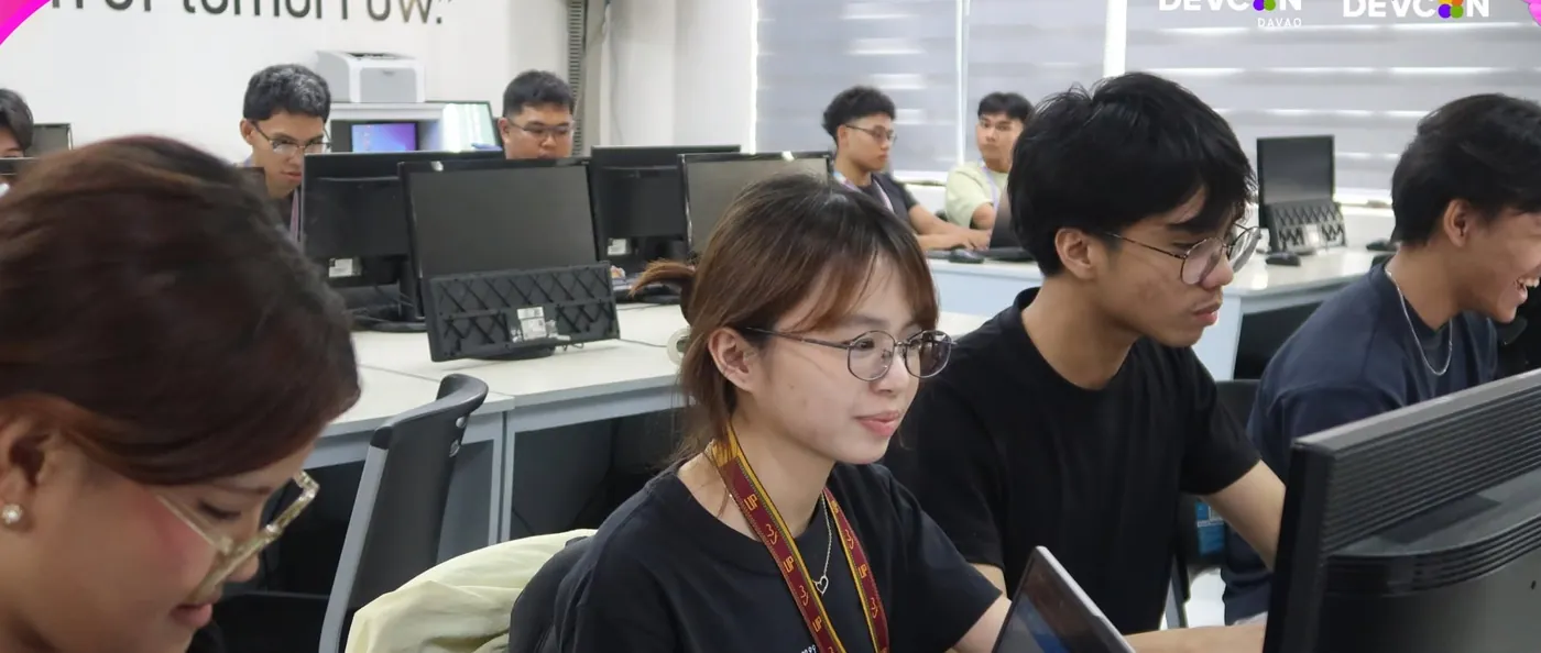 Students coding at computers during the hackathon
