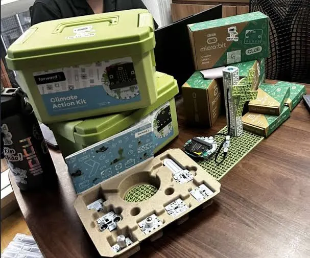 Climate Action and micro:bit kits laid out for a hands-on session