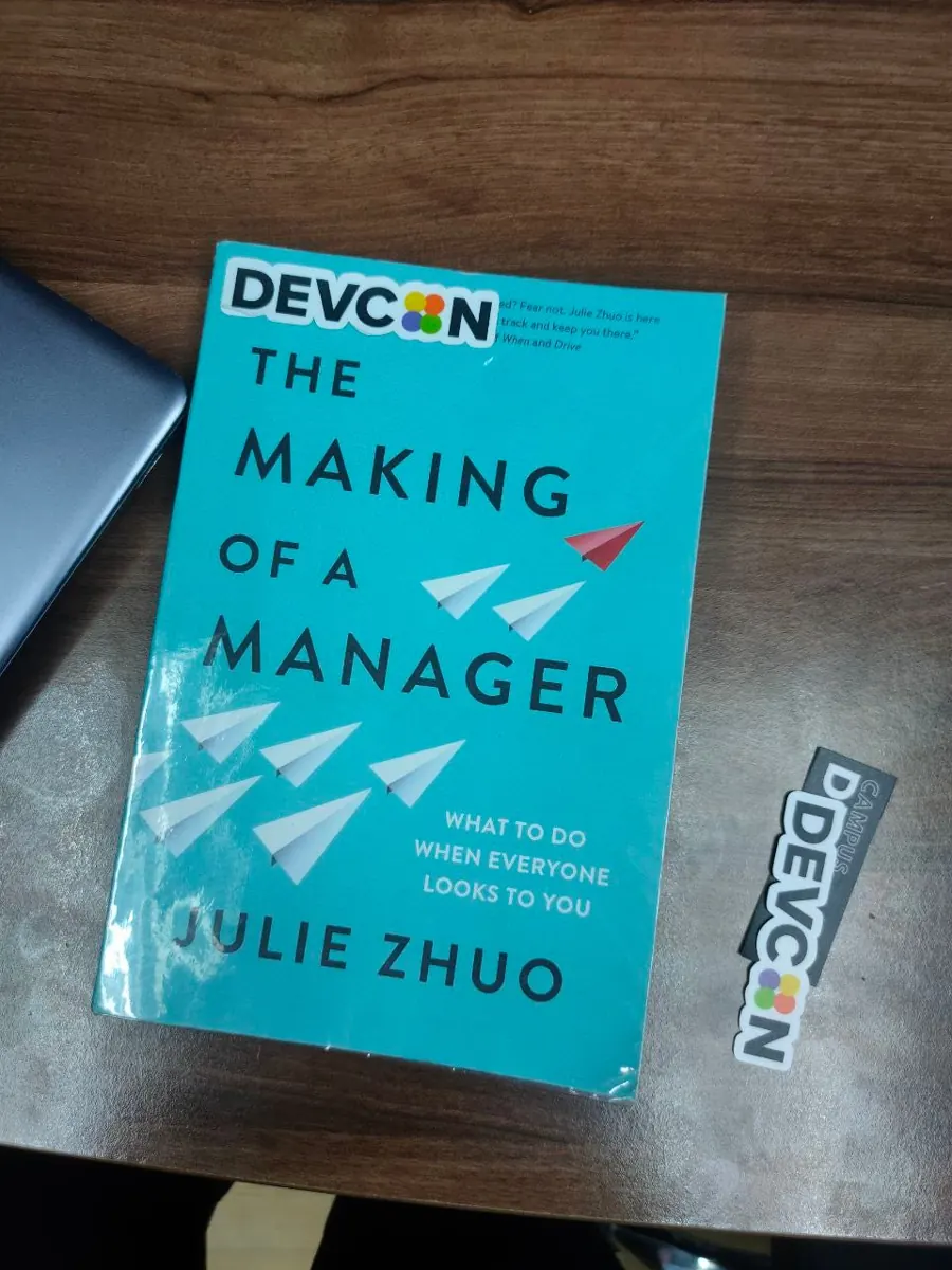 A copy of The Making of a Manager with DEVCON and Campus DEVCON stickers